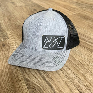 Grey / black coated aluminum badge cap